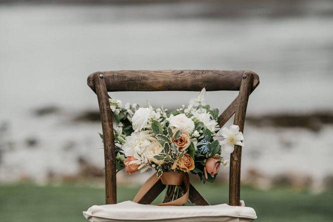 Bridal bouquet on a rustic chair