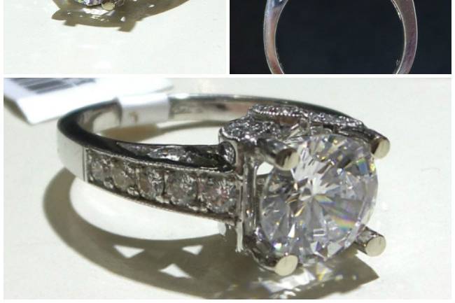 A beautiful cathedral set engagement ring with a petal motif gives this ring it's singular appeal!
18k White Gold