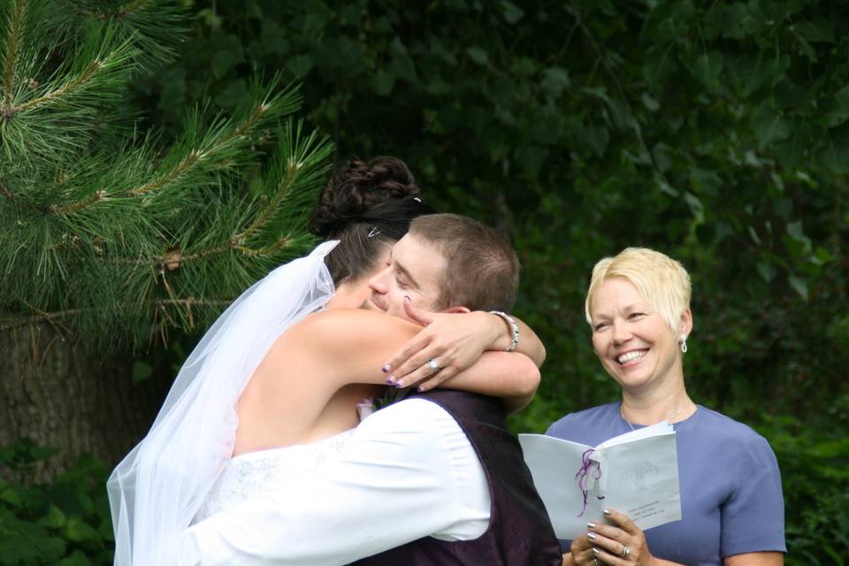 Newlyweds hugging each other