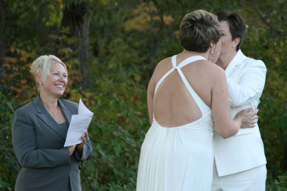 Brides kissing