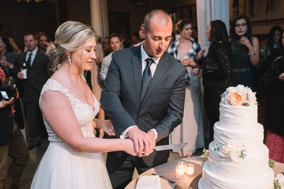 Bride and Groom Cutting Cake