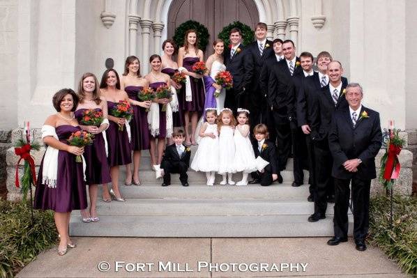 The couple with the bridesmaids and groomsmen