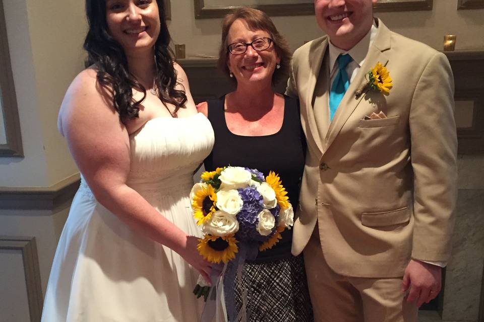 Couple with the officiant