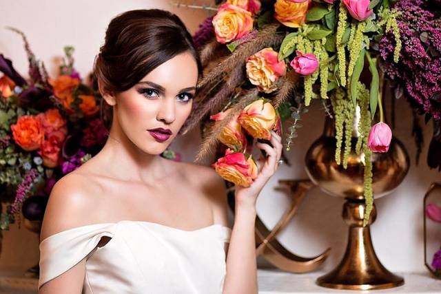 Bride by the floral centerpiece