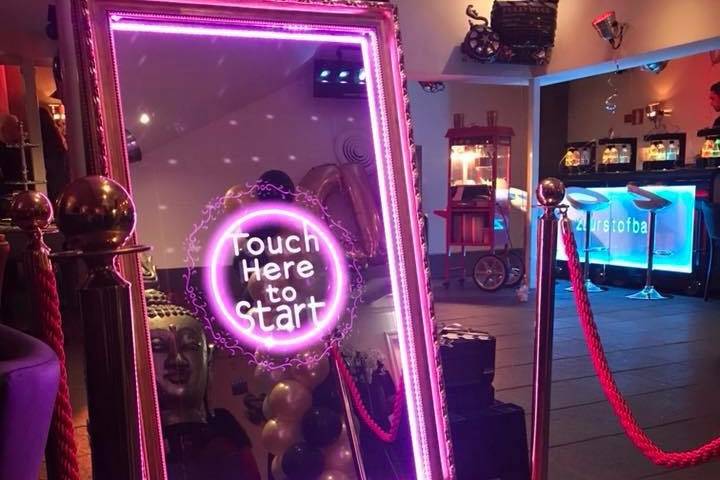 Touch screen mirror booth