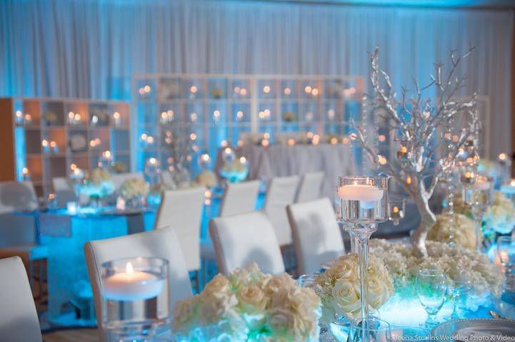 Blue lights with white floral arrangements