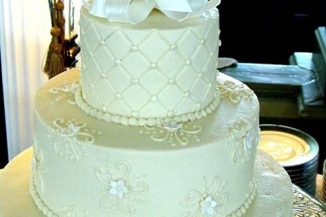 White wedding cake with ribbons