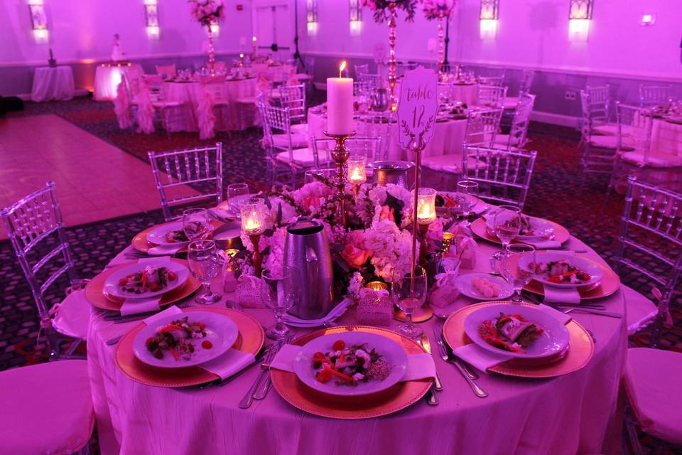 Pink lighting and candlelit tables