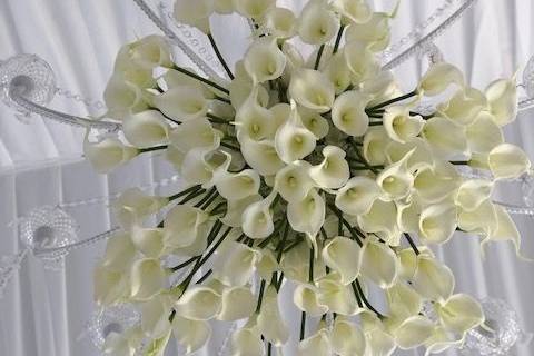 Floral arrangement hanging from the chandelier