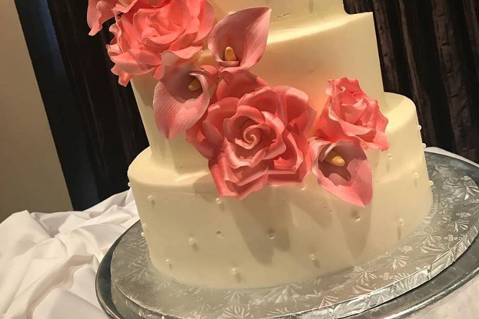 4-tier wedding cake with pink flowers