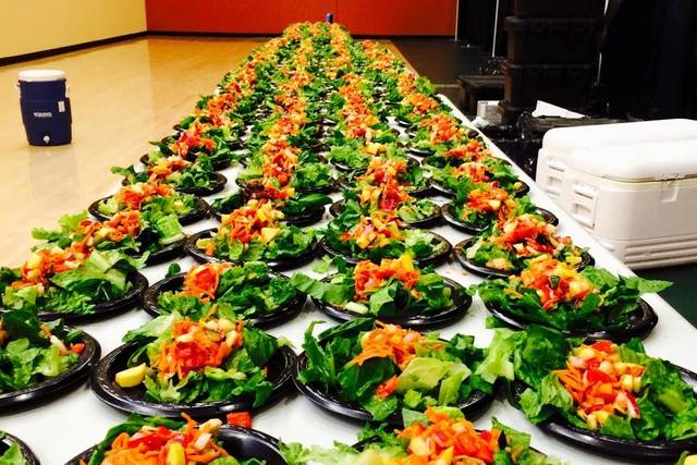 Fresh Salad, spring greens mix topped with a fresh vegetable and fruit mixture and Cranberry Vinegarrete