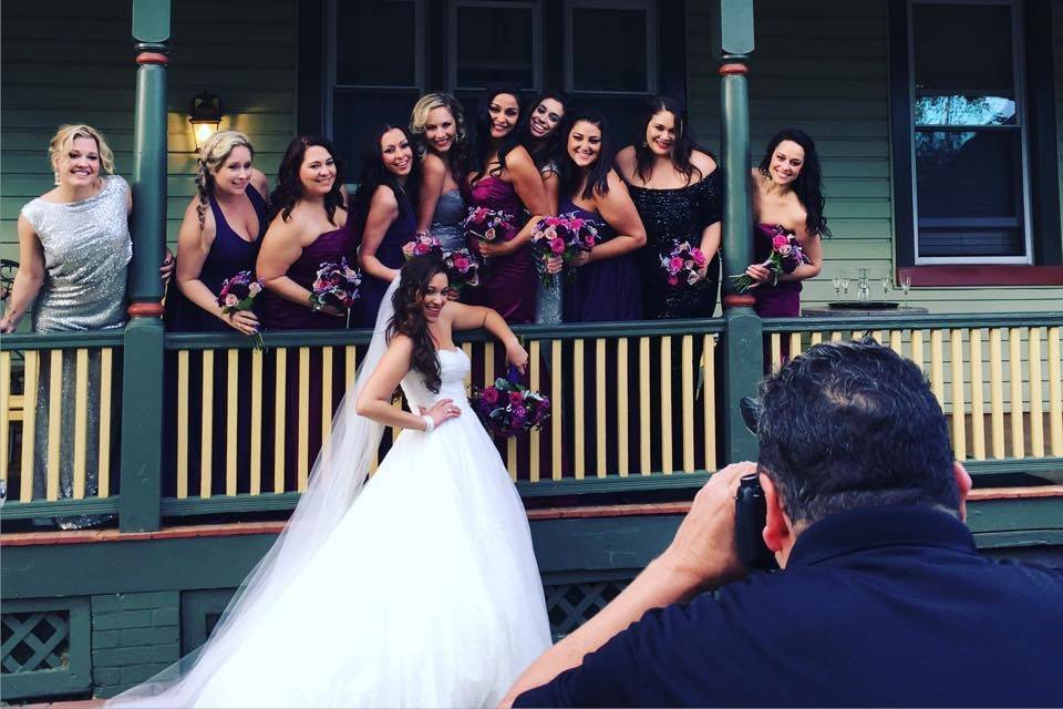 Behind the scenes photo of bridal party and bride