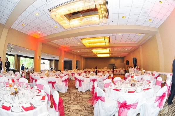 Our Chair Covers with Apple Red Sashes for a wedding at the Handlery Hotel