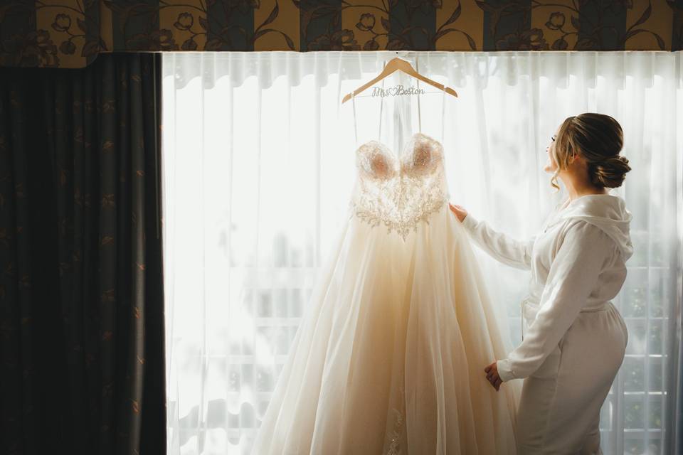 Bride admiring her dress