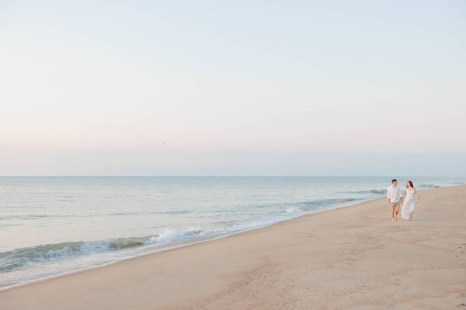 Couple walking by the ocean