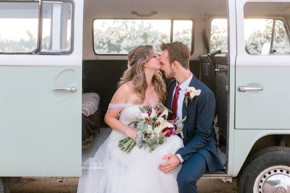Couple sitting in vw bus