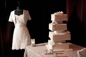 Off-set tiers with hand-piped lace design and hand-made edible flowers. Photo courtesy of Carter Elite.