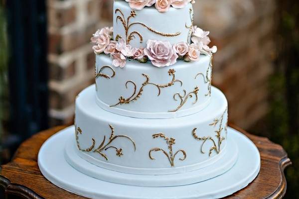 Hand-piped floral design with edible silver accents. Photo courtesy of Dara Blakely.