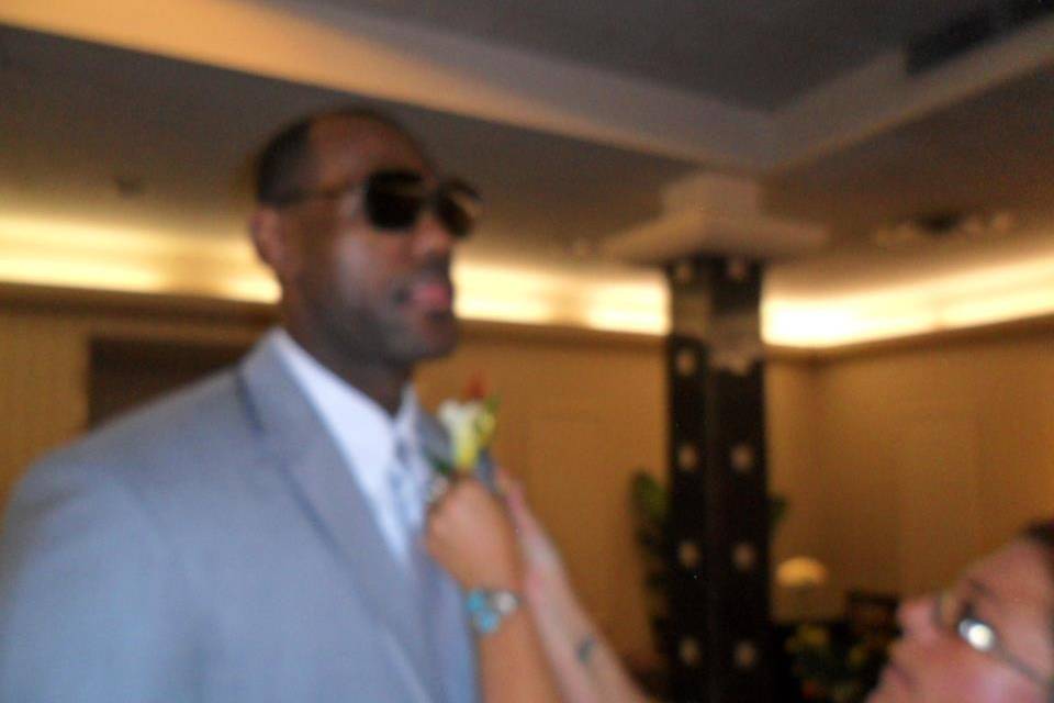 Lebron James getting his boutonniere pinned on by Shelley