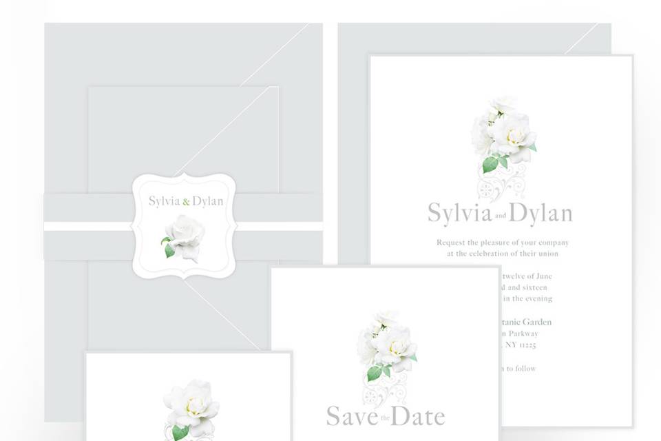 White Rose wedding suite incorporates rose/ornamental motif. Invitation is printed on white card stock with metallic silver border, other pieces are printed on Crest Solar White 130lb cover stock. Envelopes - Metallic Silver paper stock.