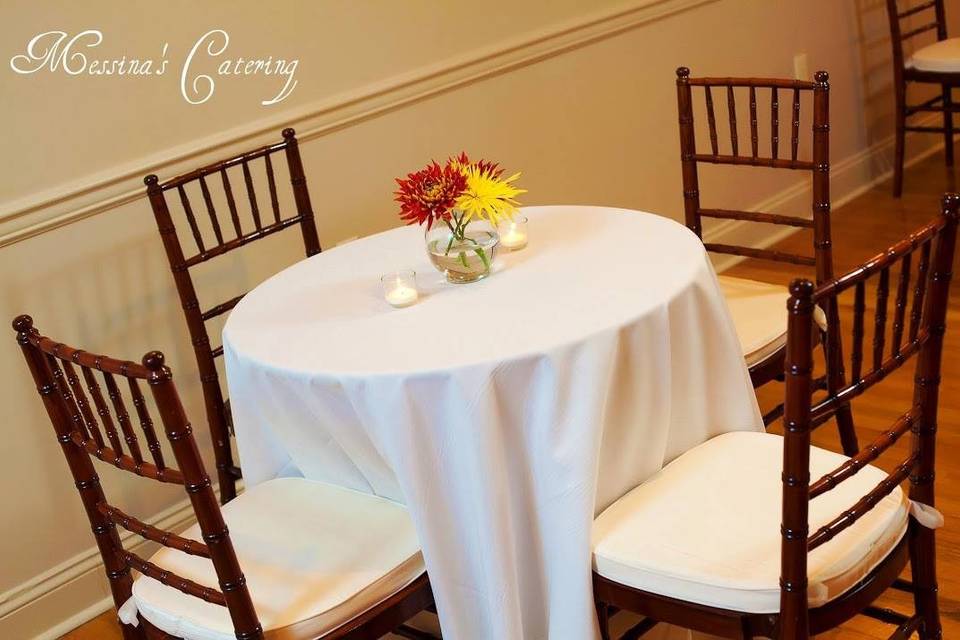 white table and chiavari chairs