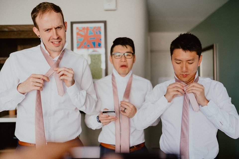 Groomsmen Try to Tie Ties