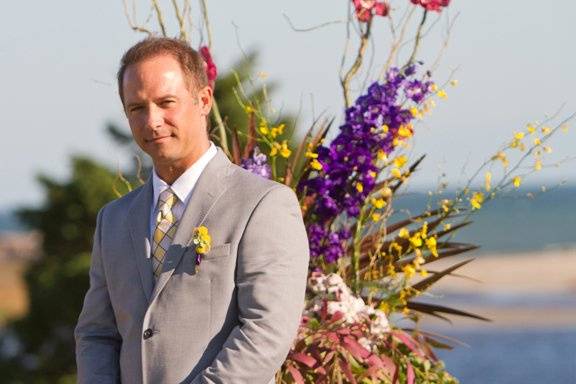 Groom awaits bride at destination beach wedding in Little Compton, Rhode Island.Photo by Julia Robinson Photo.