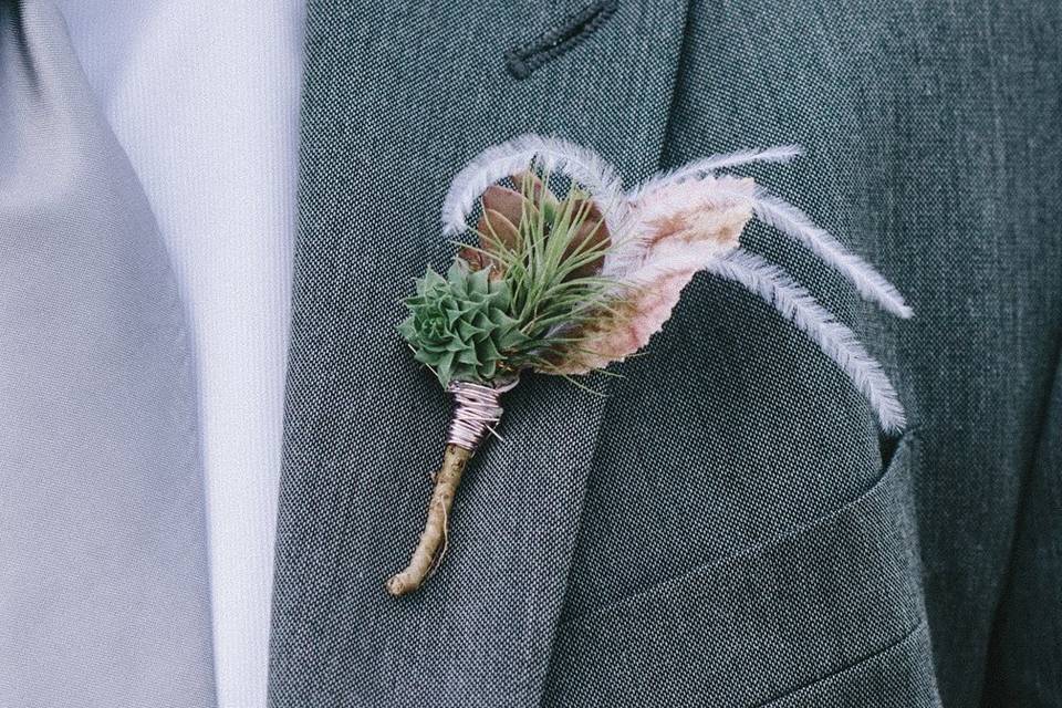 Succulent and air plant boutonniere. Photo by Nathan Russell Photo.