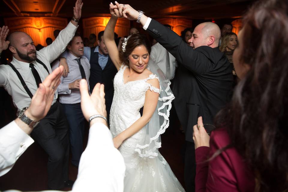 Couple dancing among guests