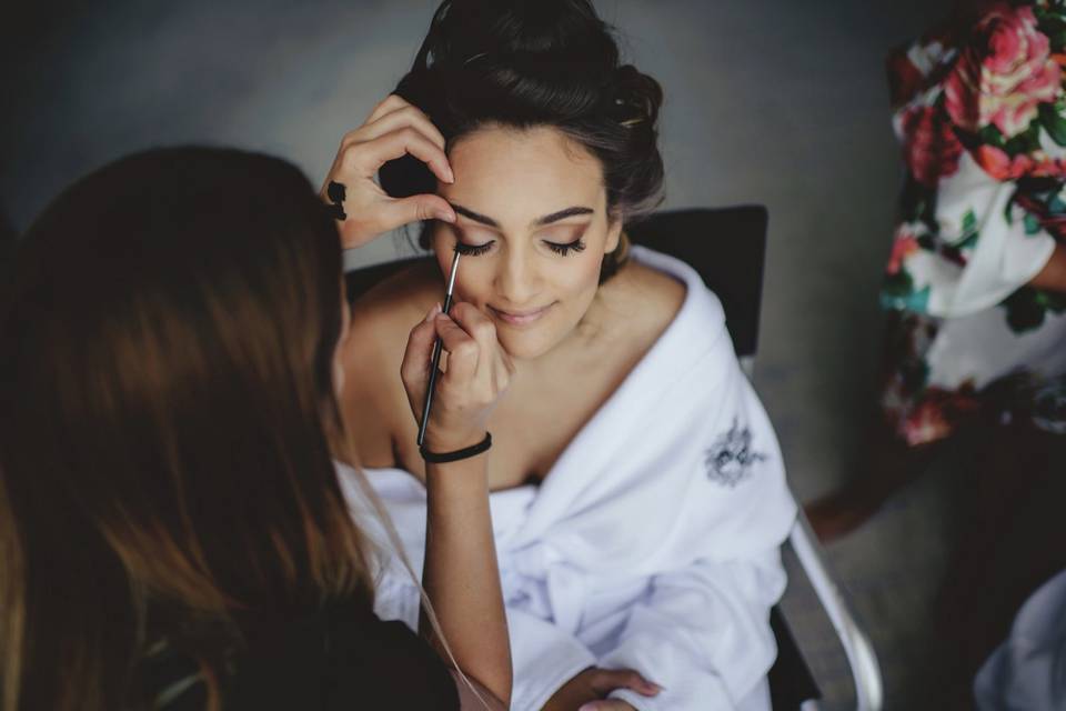 Bride getting makeup done