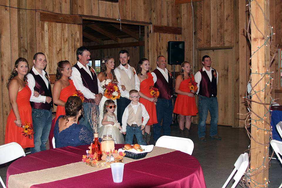 The couple with the bridesmaids, groomsmen and kids