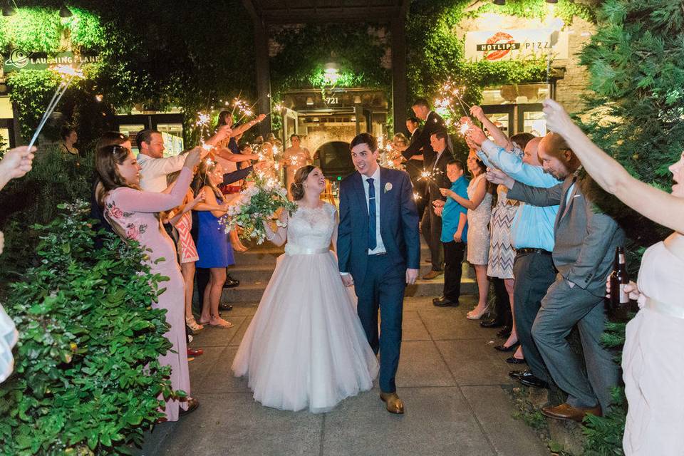 Bride and groom walking down into the venue