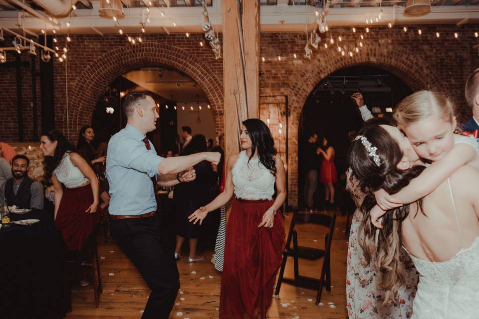 Wedding party dancing at the Irving Street Studio