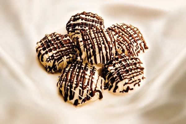 Imagine yourself eating the perfect cookie, double dark and semi sweet chocolates, infused with soft, fluffy marshmallows and roasted almonds, then completely immersed in white chocolate with dark chocolate drizzle…yummmmmm.
http://www.heidisheavenlycookies.com/products/Heavenly_Rock_A_Mallow-60-0.html