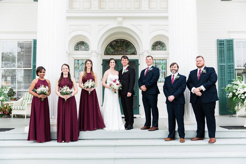 Bridal party on front veranda.Courtesy Casto Photo