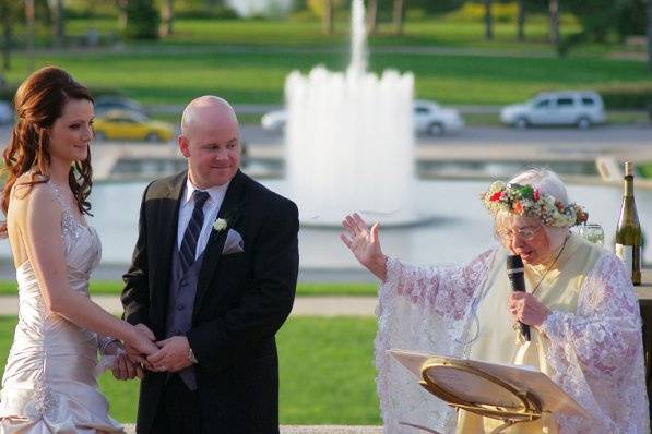 The bride wore pearl satin and they were married at the World's Fair Pavilion in Forest Park.