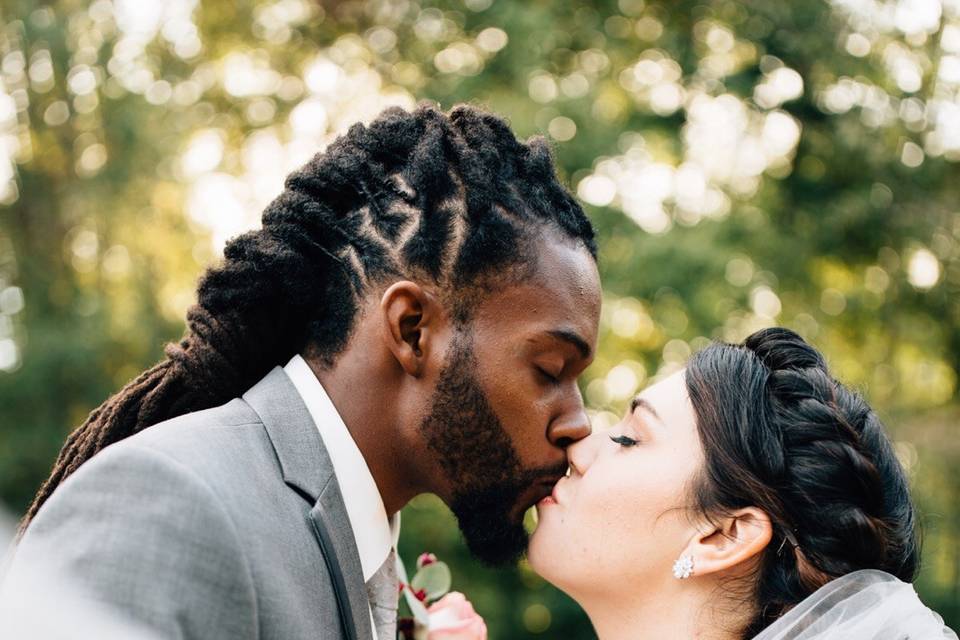 Groom and bride kissing