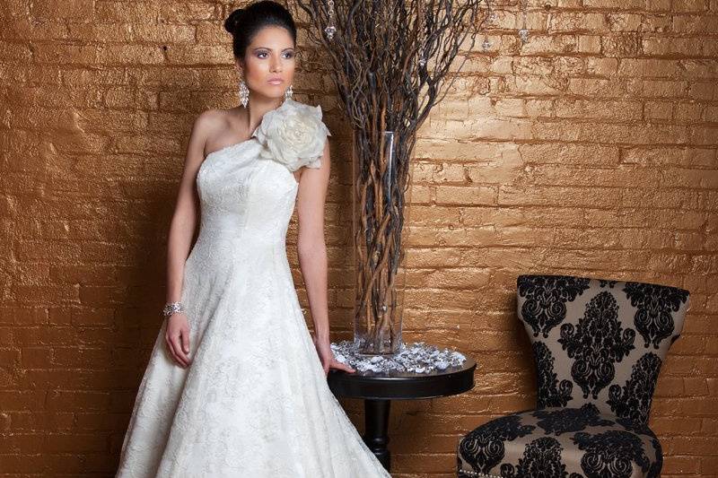 CarmenChantilly lace & Silk Charmeuse. Aline lace gown with asymmetric one shoulder bodice and chapel length train.