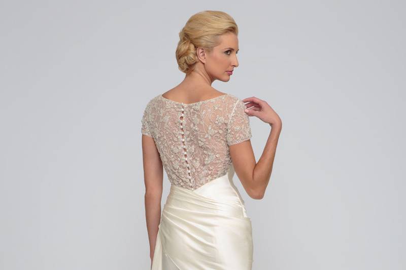 Candace	Silk Charmeuse.  Sheath gown with draped asymmetric waist line.  Sweetheart neckline and draped bodice.  Bodice accented with beaded illusion sleeves and back.  Chapel length train.