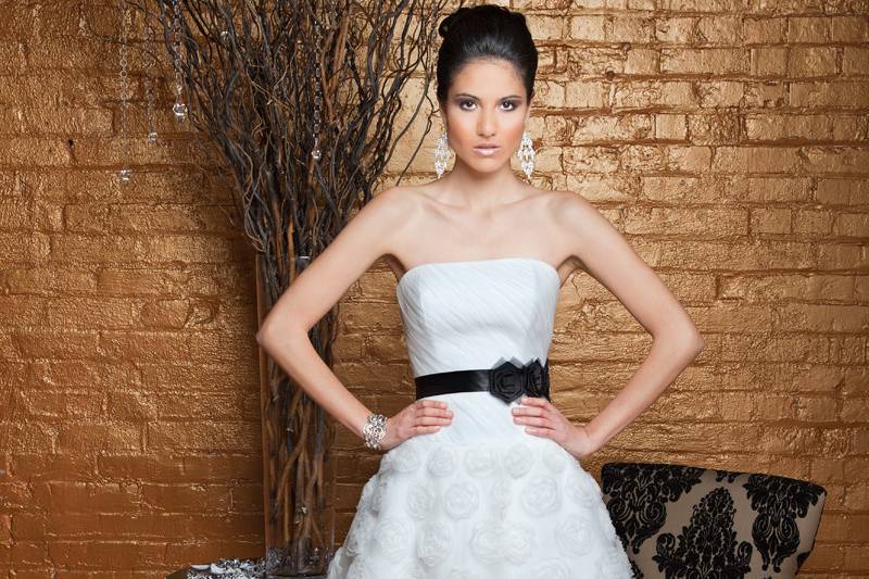 Heidi	Tulle & Organza.  A-Line cocktail gown.  Strapless, asymmetrically draped dropped waist bodice.  A-Line skirt is accented with three dimensional organza ribbon detail.