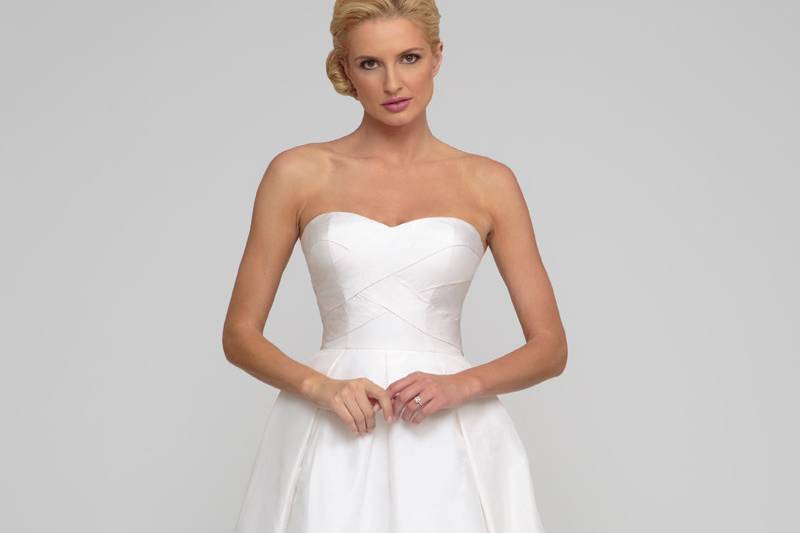 Alyssa Silk taffeta.  Natural waist ball gown with box pleats and sweep train.  Sweetheart neckline and draping accentuate the bodice.  Matching bolero available upon request.