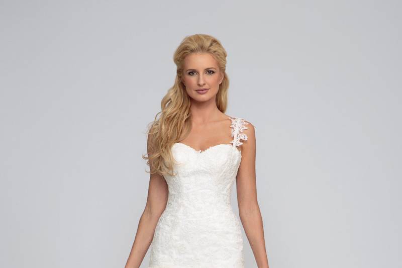 Reina 	Re-Embroidered Lace.  Fit to flair gown with shredded tulle skirt and lace trim.  Sweetheart neckline with lace strap and bodice.  Tulle and scallop lace trim cathedral length train.
