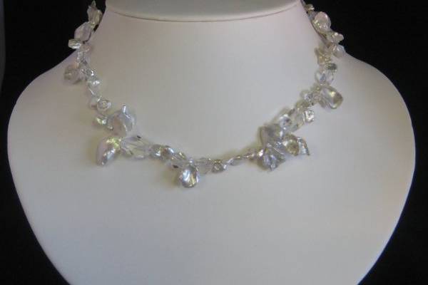 JULIA/$82.- Single strand of textured large and small keishi pearls with faceted crystal quartz and sterling silver clasp.  If yor'e looking for something that says