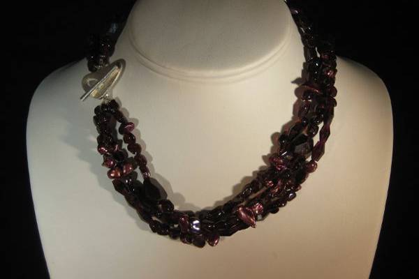 ADRIENNE/$150.00-  3-strand beautiful deep shades o faceted smooth garnet and wine pearls with a brushed sterling silver heart toggle-16 1/2