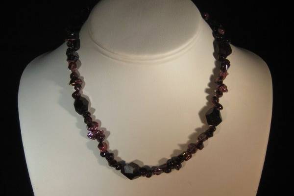 KATE/$56.- Single strand of beautiful deep shades of faceted and smooth garnet and wine textured pearls with a sterling silver clasp- 16 1/2
