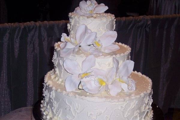 Cake stacked to the back to look like stair steps.