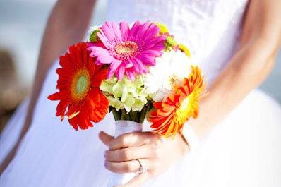 An adorable gerber daisy bridal bouquet from a wedding at St Edwards Catholic Church in Dana Point, Ca (with a reception at the Ocean Institute in Dana Point). Thank you to Jolynne Photography for sharing the photo with us.