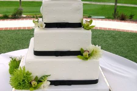 From a wedding at Laguna Cliffs Resort and Spa in Dana Point, Ca. The beautiful cake is from It's All About the Cake