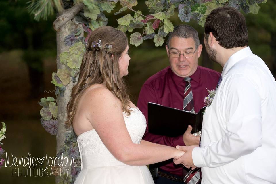 Officiant pronouncing newlyweds