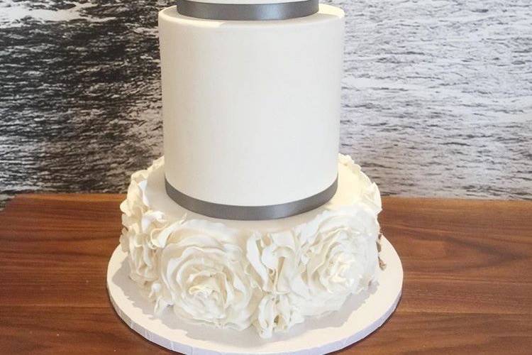 Three tier wedding cake with silver lining